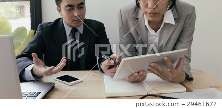 Businessman using a digital tablet to discuss Businessman using a digital tablet to discuss 29461672