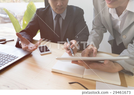 Businessman using a digital tablet to discuss Businessman using a digital tablet to discuss 29461673