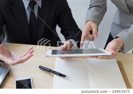 Businessman using a digital tablet to discuss Businessman using a digital tablet to discuss 29461675