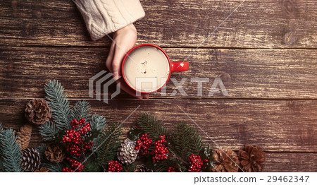 photo of red cup of coffee near dried cones 29462347