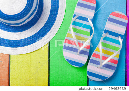 colorful sandals and hat on table 29462689