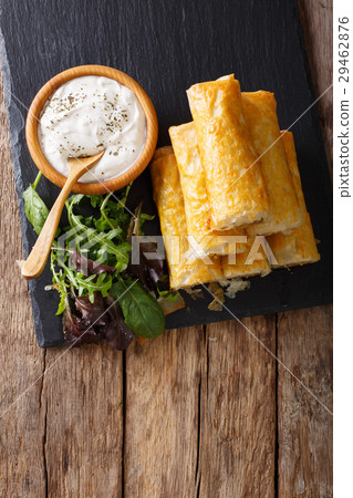Filo rolls with meat, eggs and greens close-up 29462876