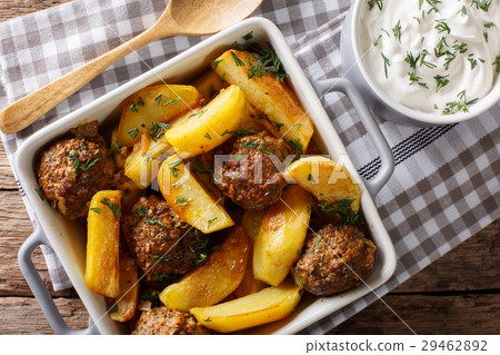 Meat balls with potatoes in a baking dish 29462892