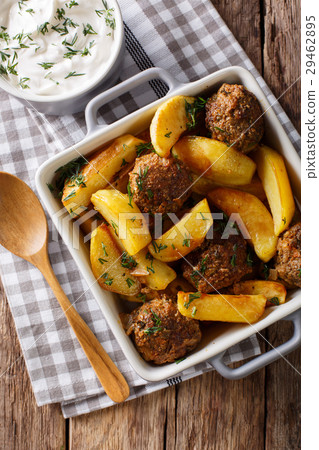 Meat balls with potatoes in a baking dish Meat balls with potatoes in a baking dish 29462895