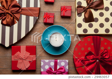 photo of cup of coffee near different gifts photo of cup of coffee near different gifts 29463057