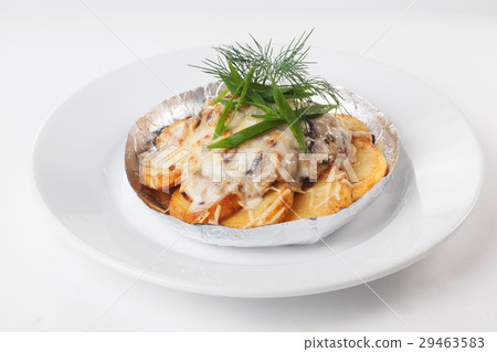potatoes with mushrooms in foil isolated white 29463583