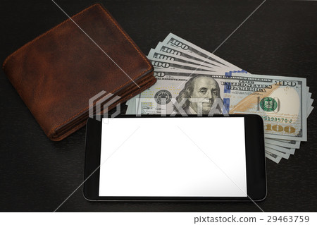 Money, wallet and cell phone lie on a table Money, wallet and cell phone lie on a table 29463759