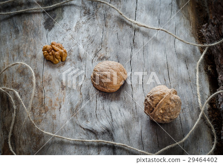 Walnuts on aged wood. Closeup Walnuts on aged wood. Closeup 29464402