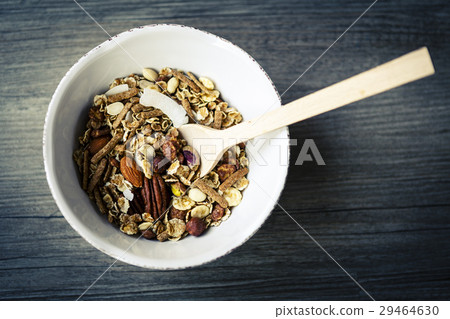 bowl with muesli and spoon on the wooden table bowl with muesli and spoon on the wooden table 29464630