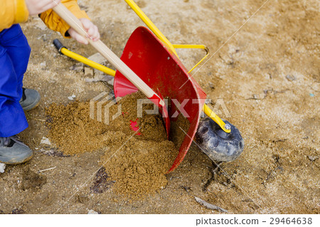 child play with sand, red shovel and small cute child play with sand, red shovel and small cute 29464638