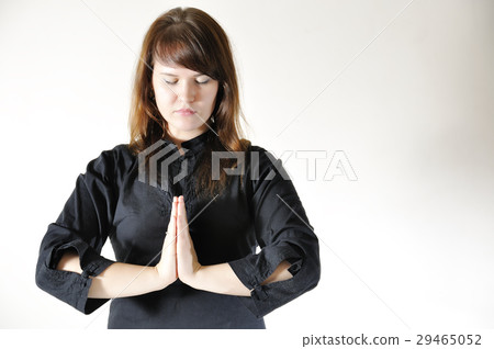 Young woman in the prayer lotus position. Young woman in the prayer lotus position. 29465052