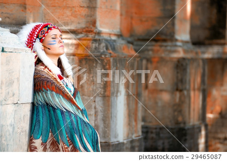 Young woman in war bonnet headdress of American Indian 29465087