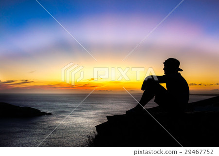 Boy enjoying the sunset at the and turquoise beach Boy enjoying the sunset at the and turquoise beach 29467752