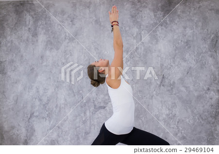 Young attractive woman practicing yoga, standing 29469104