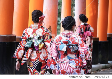 geishas among red wooden Tori Gate geishas among red wooden Tori Gate 29476174