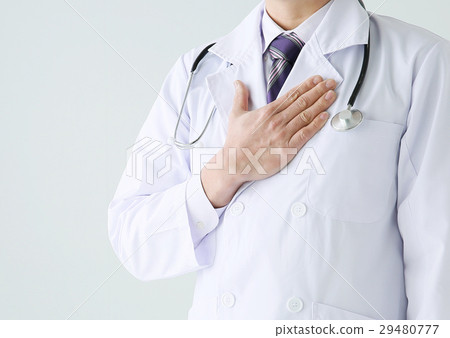Male doctor putting hands on my chest 29480777
