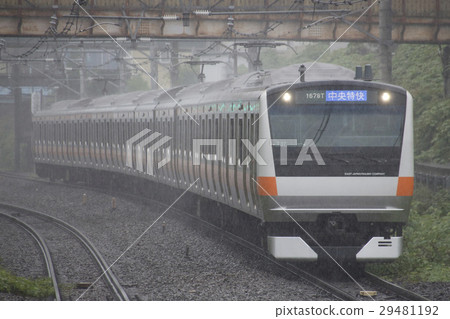 Chuo Rapid Line E233 Series train (Chuo Limited Express) running through a sudden downpour 29481192