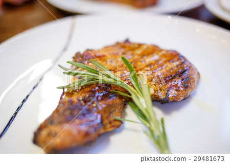 Close up image of beef steak with twig of rosemary 29481673