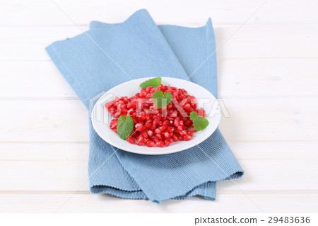 plate of pomegranate seeds 29483636