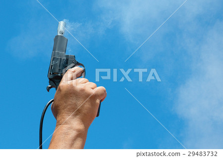 Starter.Hand firing a gun for starting race 29483732