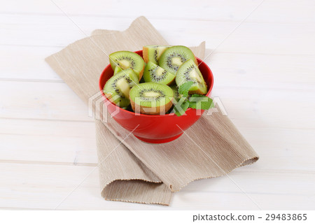 bowl of kiwi halves and quarters bowl of kiwi halves and quarters 29483865