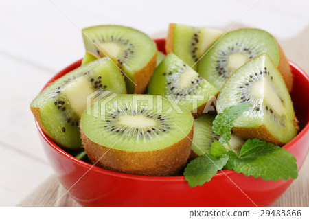 bowl of kiwi halves and quarters bowl of kiwi halves and quarters 29483866