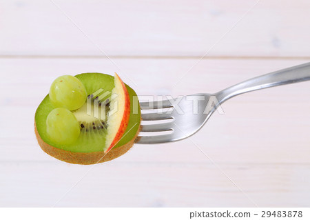 slice of kiwi on fork slice of kiwi on fork 29483878