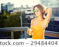 Young Fashion Woman with Coffee to Go in the City 29484404