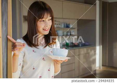 A young Japanese woman working in a cafe A young Japanese woman working in a cafe 29484835