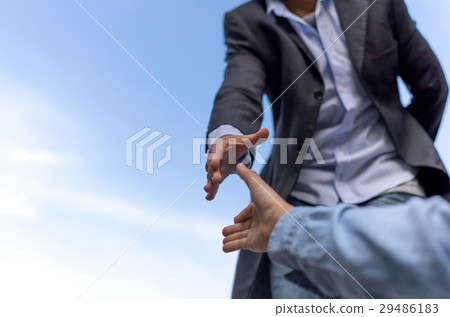 Help concept hand reaching out to helping people 29486183