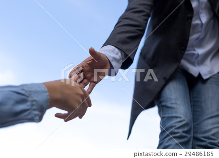 Help concept hand reaching out to helping people 29486185
