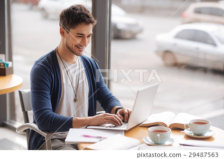 Young handsome guy working on computer 29487563