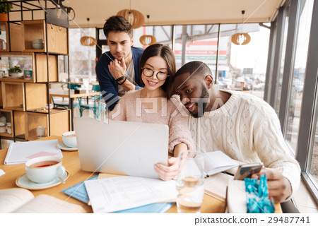 Group of students using studying together Group of students using studying together 29487741