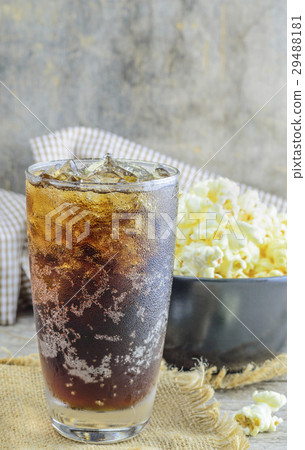 Cola with Ice and Popcorn on a wooden background 29488181