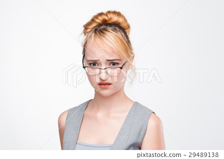 Young woman concerned and worried about problem Young woman concerned and worried about problem 29489138