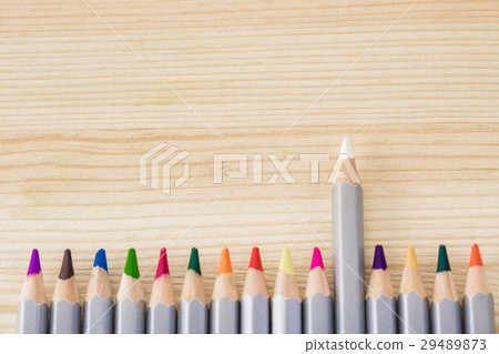 set of different colored pencils on wooden desk set of different colored pencils on wooden desk 29489873