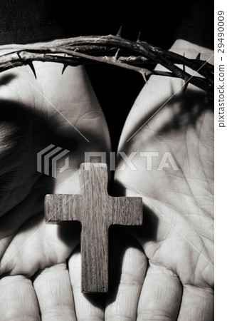man with a cross and a crown of thorns 29490009