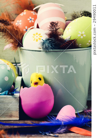decorated easter eggs, feathers and toy chick decorated easter eggs, feathers and toy chick 29490011