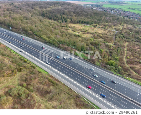Aerial view of cars on a motorway in rural country 29490261