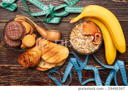 Measuring tapes, fruits and sweets. 29490367