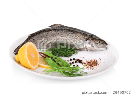Rainbow trouts with lemon and greens isolated  29490702