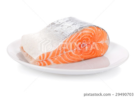 Raw steak of salmon on white plate isolated 29490703