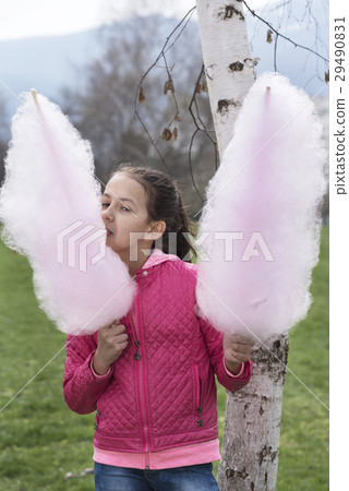 Girl with candy floss in each hand Girl with candy floss in each hand 29490831