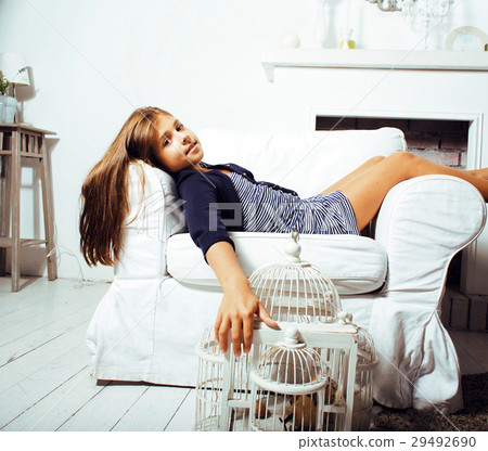 little cute brunette girl at home interior happy little cute brunette girl at home interior happy 29492690