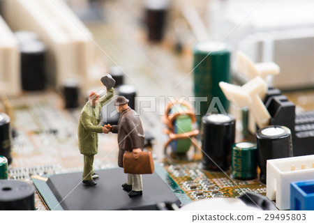 Computer base and miniature businessmen Computer base and miniature businessmen 29495803