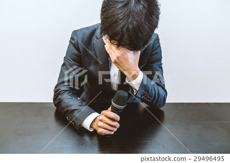 A man crying at the press conference 29496495