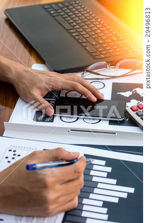 Business workers discussing digital graphs  29496813