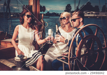 Stylish wealthy friends having fun on a luxury Stylish wealthy friends having fun on a luxury 29498842