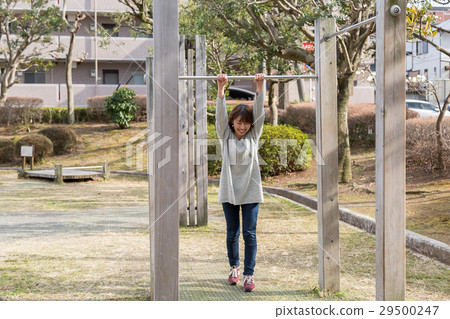 A woman holding a steel bar 29500247