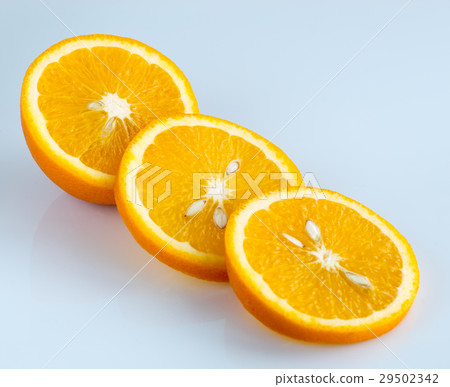 Sliced orange on a light blue background 29502342
